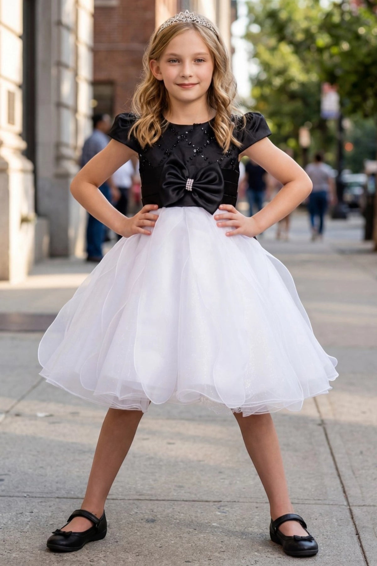 Black/White kids party dress with puff sleeves and a large satin waist bow.