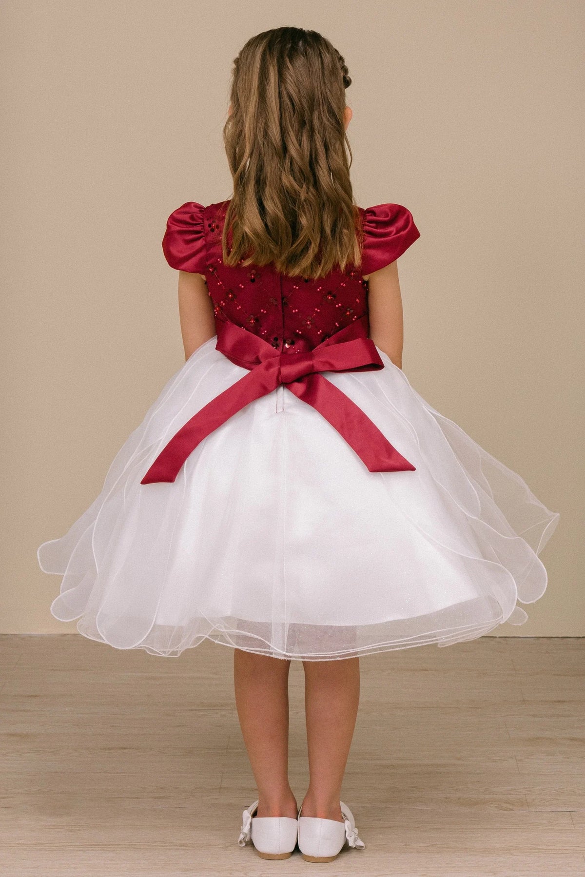Layered ivory organza flares beneath the burgundy sash of this Burgundy/Ivory kids party dress.