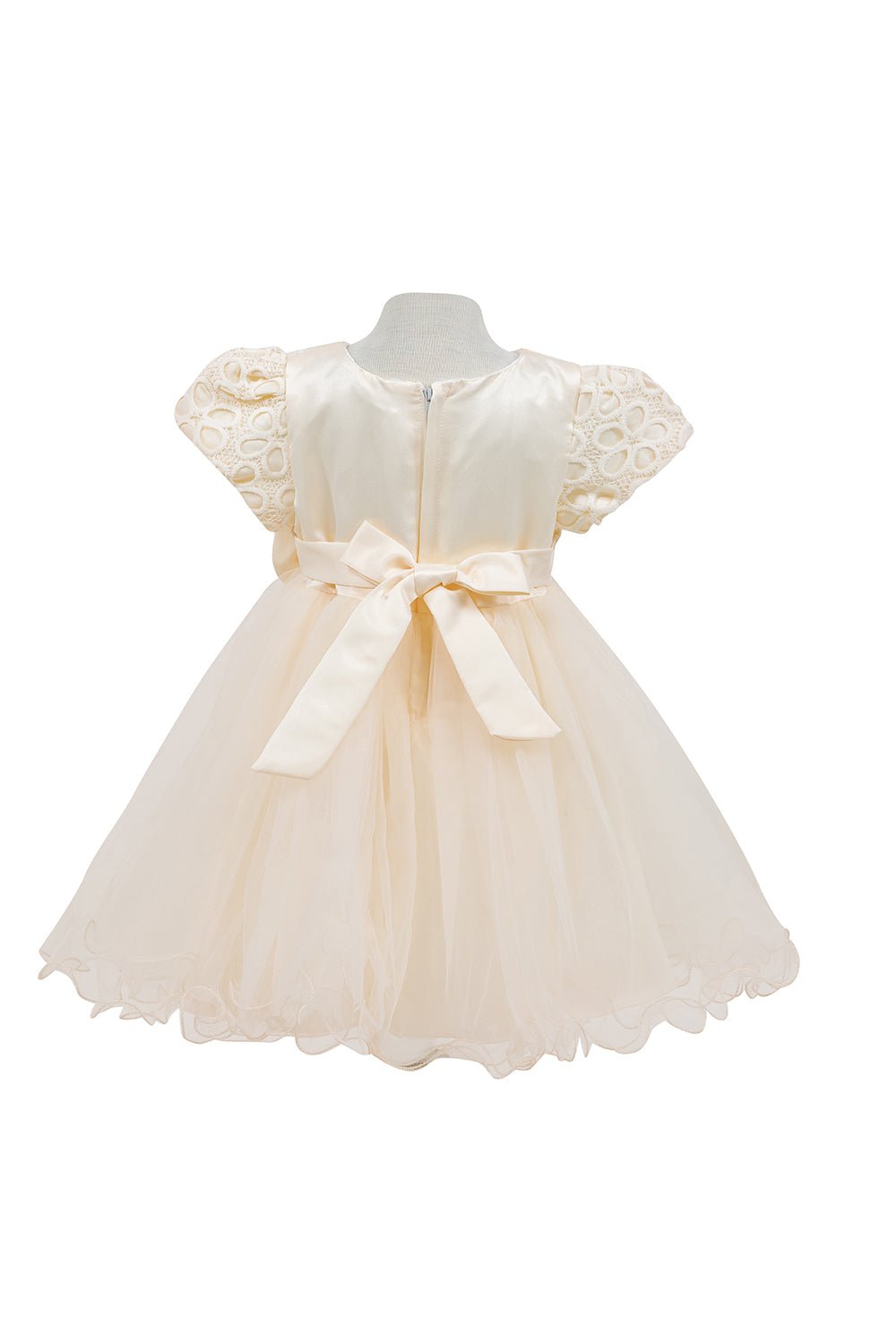 Champagne flower girl dress back view highlighting voluminous tulle skirt and elegant silhouette.