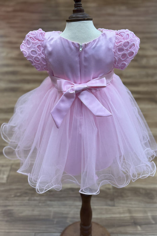 Pink dress back view highlighting full skirt and elegant silhouette