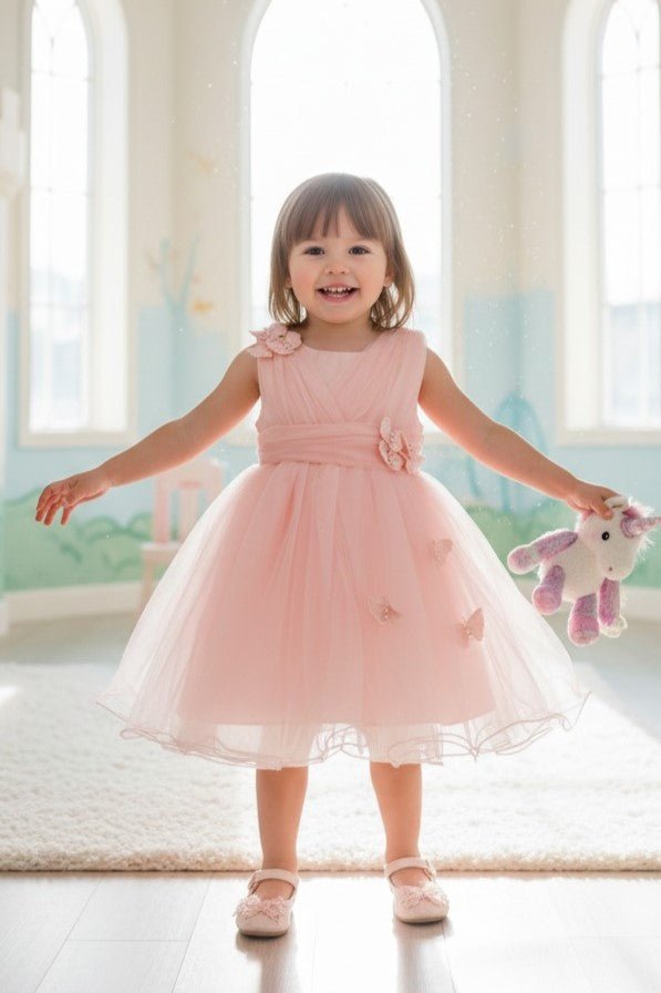 Peach flower girl Dress Front View With Layered Skirt And Oversized Bow Detail.