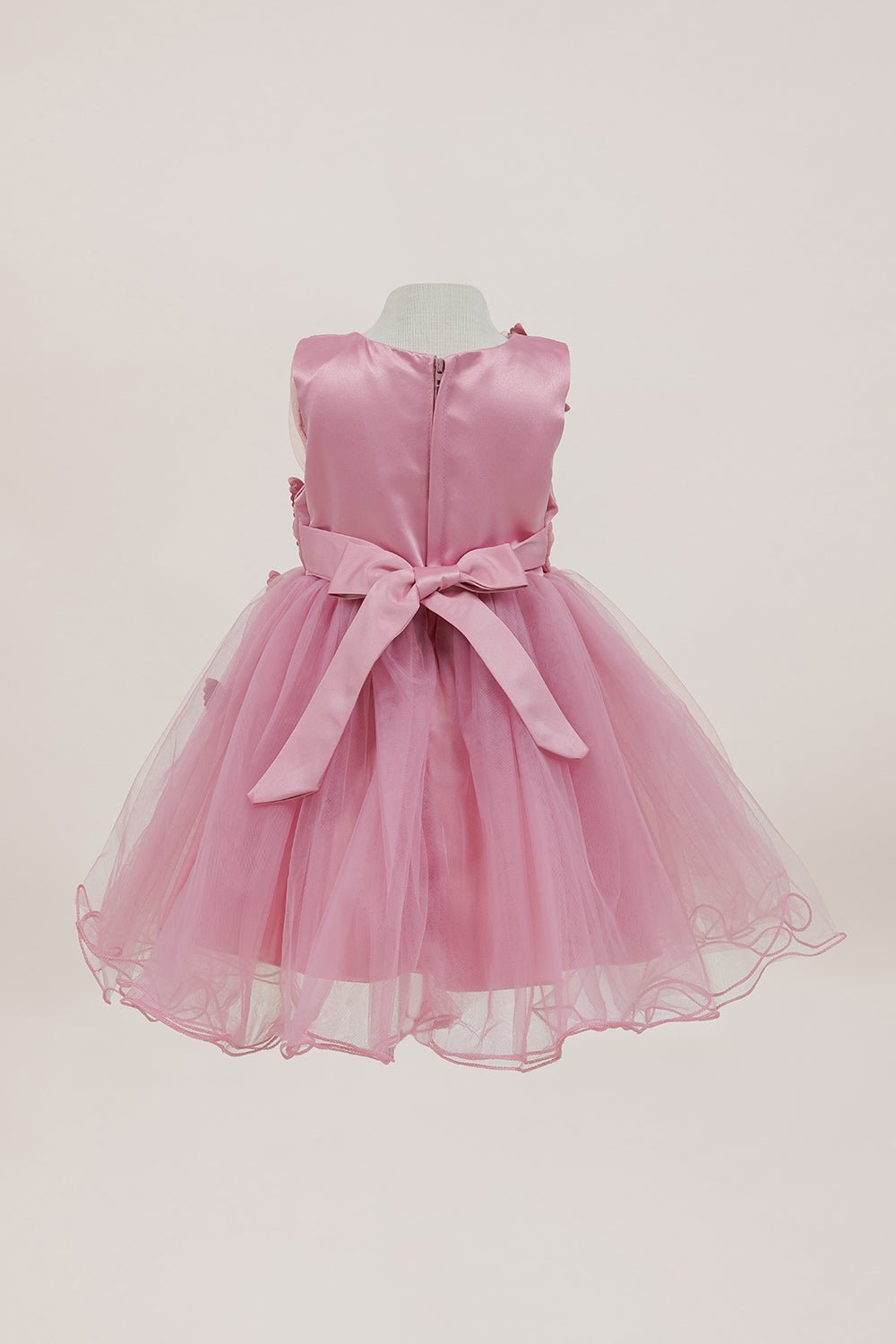 Rose flower girl dress back view highlighting full skirt and elegant silhouette.