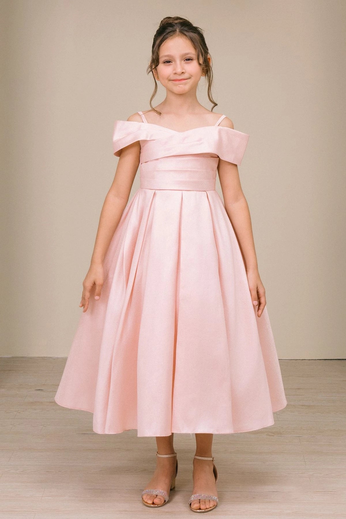 Showcasing with a folded off-shoulder neckline, this Blush kids party dress displays elegant detail.