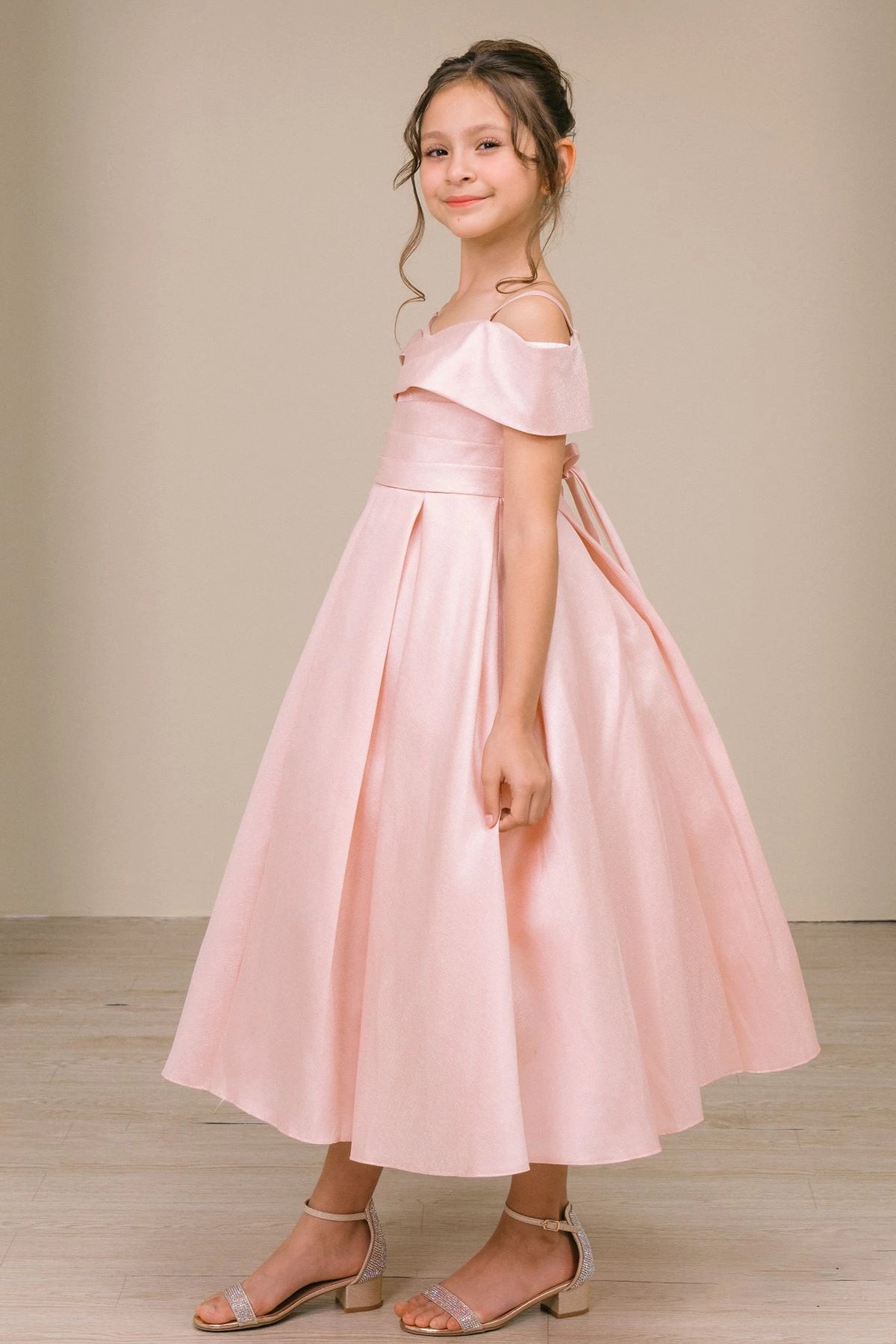 Featuring with a folded off-shoulder neckline, this Blush kids party dress displays elegant detail.