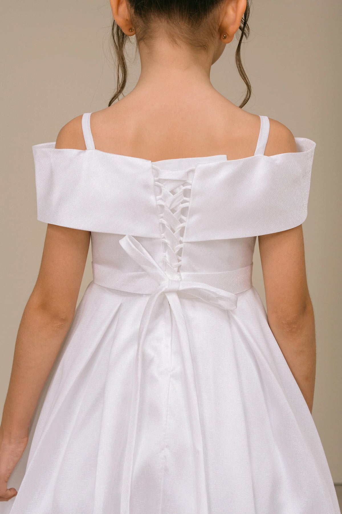 Finished details of back lacing and a waist sash distinguish the Off-White kids party dress.