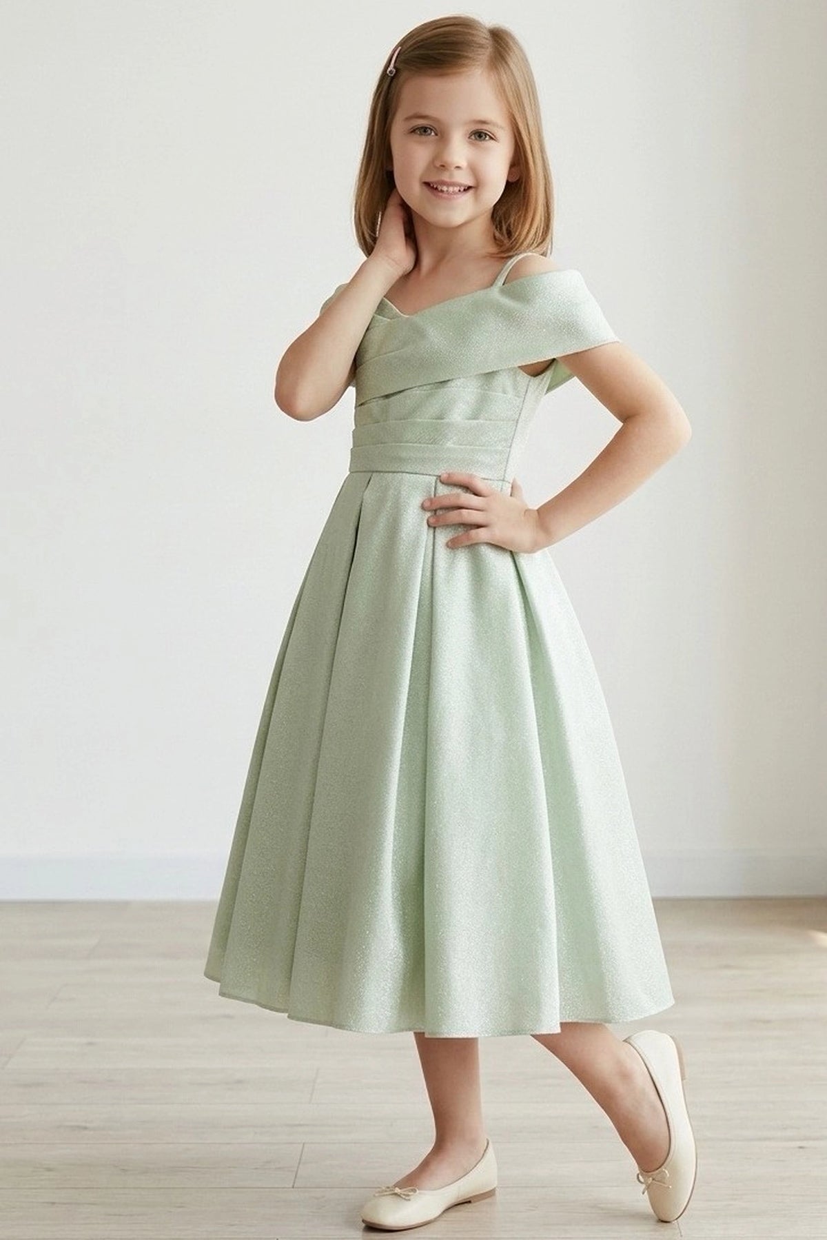 Detailed by a ruched waist band, the Sage kids party dress reveals its construction.