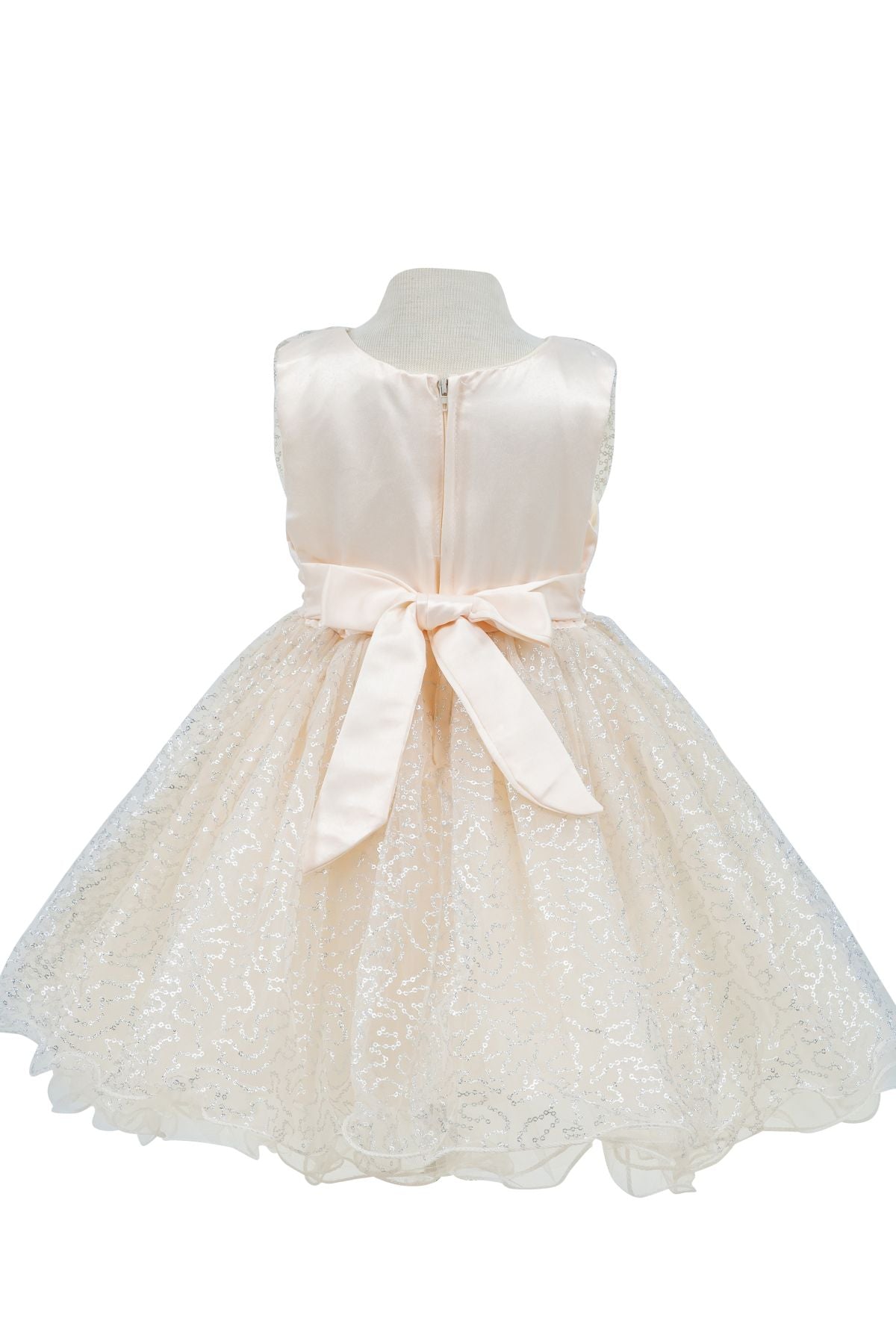 Champagne flower girl dress back view highlighting full skirt and elegant silhouette.