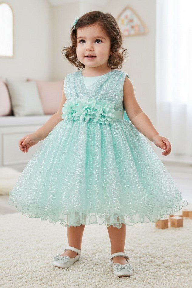 Mint flower girl Dress Front View With Layered Skirt And Oversized Bow Detail.