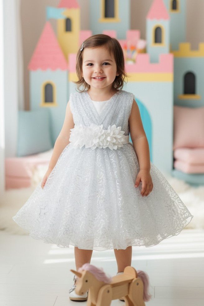 White flower girl Dress Front View With Layered Skirt And Oversized Bow Detail.