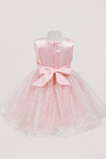 Peach dress back view highlighting full skirt and elegant silhouette
