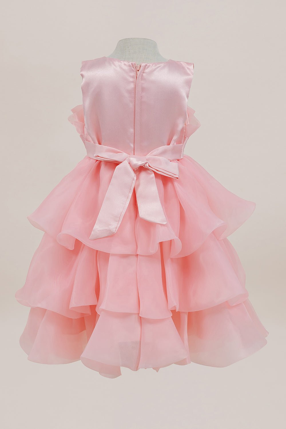 Lilac flower girl dress back view highlighting full skirt and elegant silhouette.