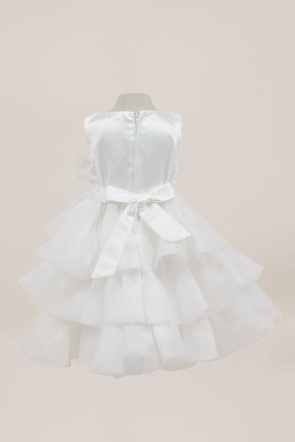 White dress back view highlighting full skirt and elegant silhouette