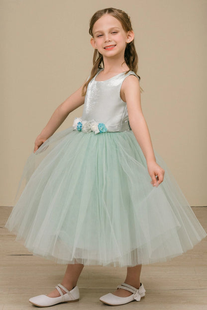 Featuring layered tulle hem beside the floral waistband on the Sage flower girl dress.