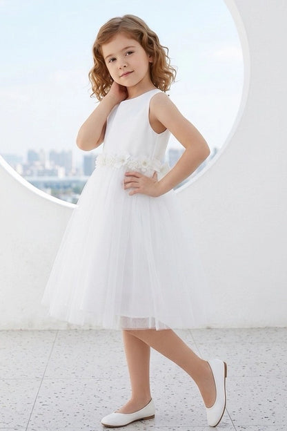 Visible on this White flower girl dress: raised flowers above the layered skirt.