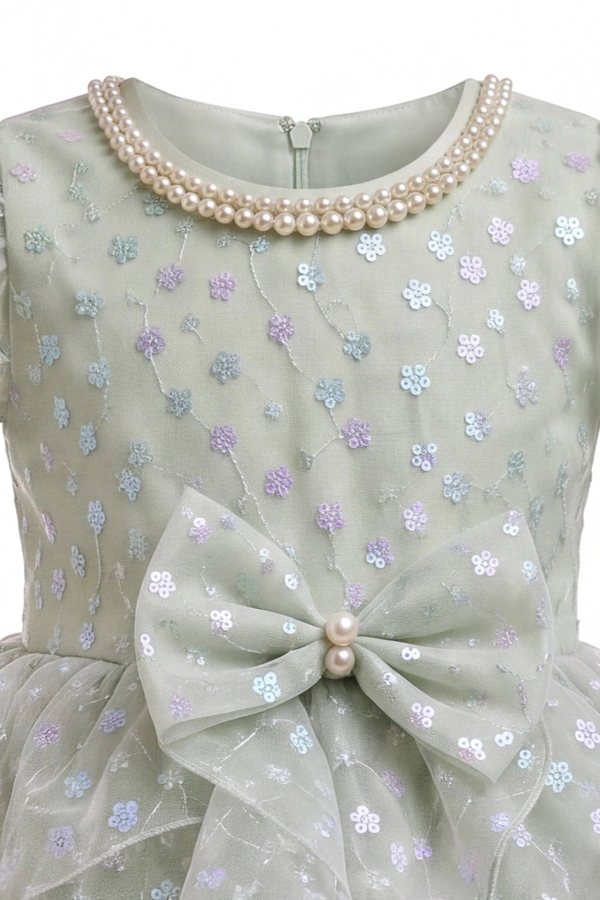 Detailed a flower-patterned waist bow complements the Sage kids dress.