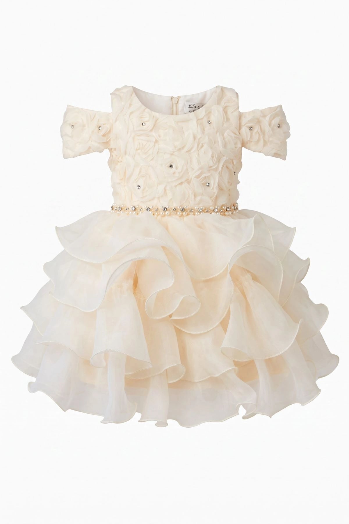 Layered shaping highlights dimensional rosettes across the bodice on the Champagne kids dress.