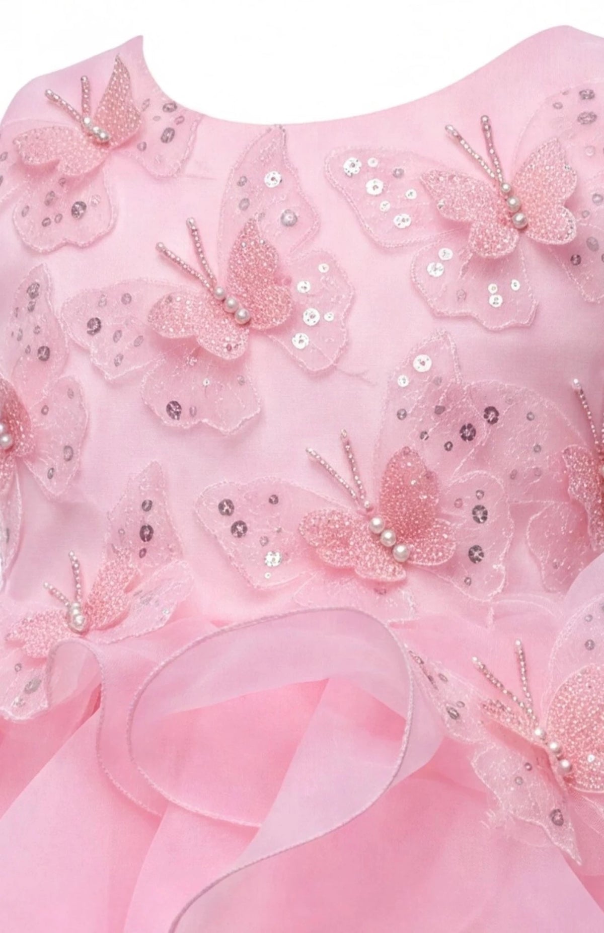 Detailed a ruffled full skirt complements the Pink kids dress.