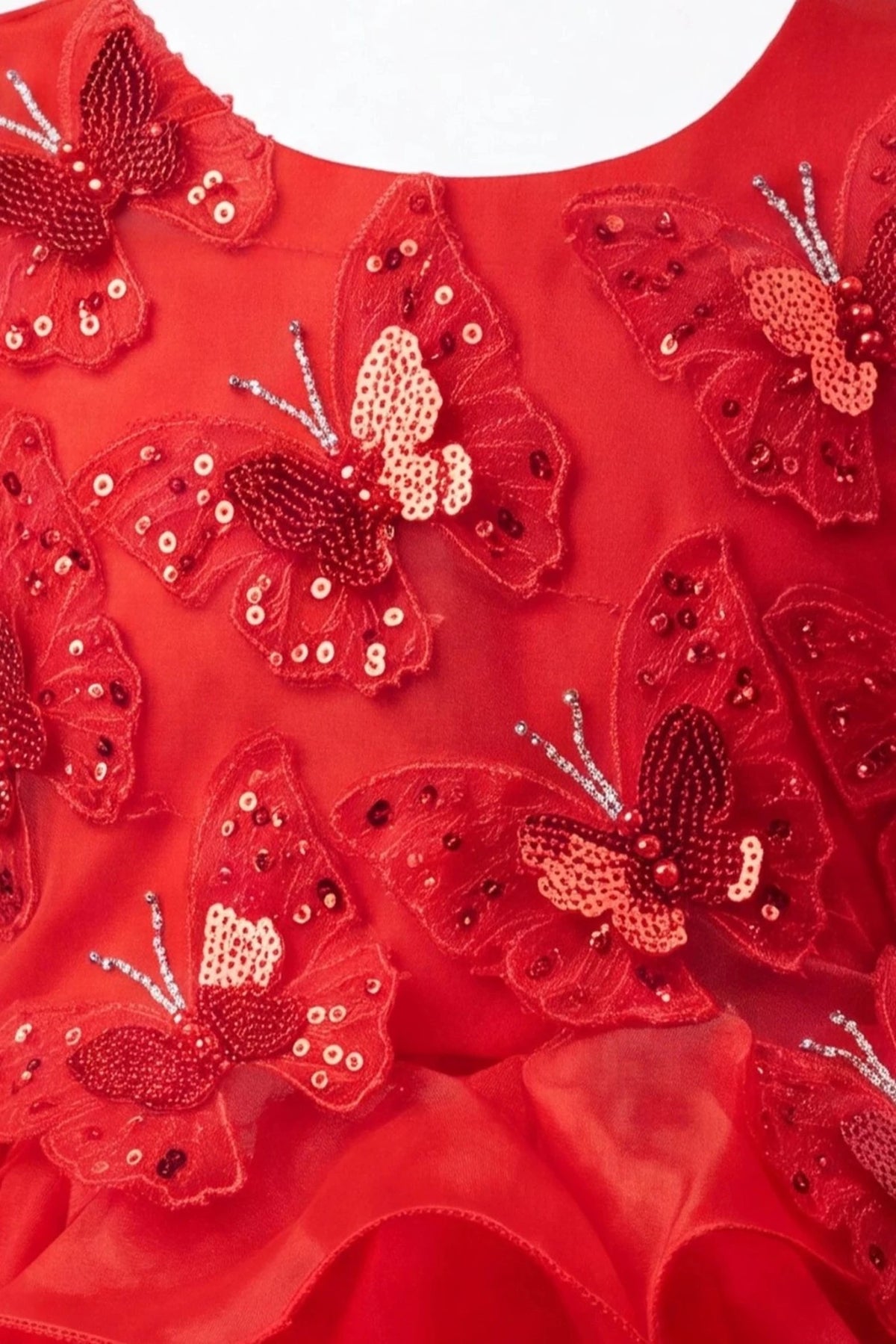 Detailed a ruffled full skirt complements the Red kids dress.