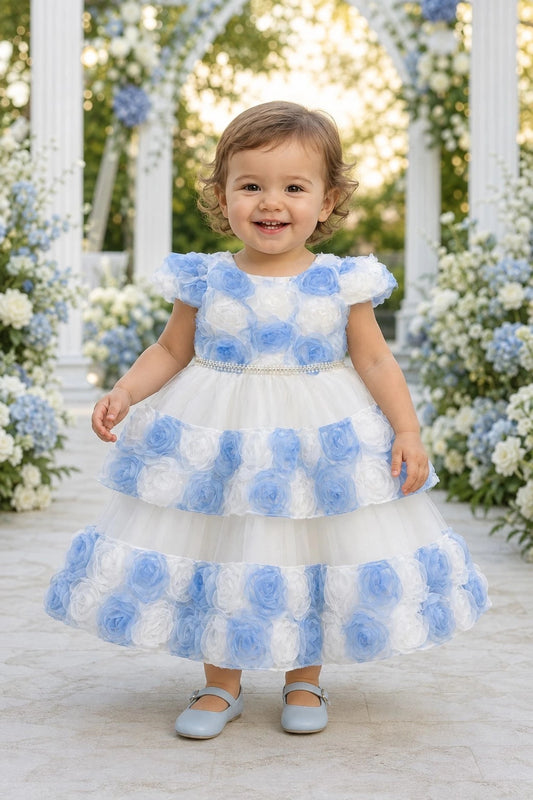 Showcasing rosette flowers across the skirt tiers, this Blue kids dress has a full skirt.