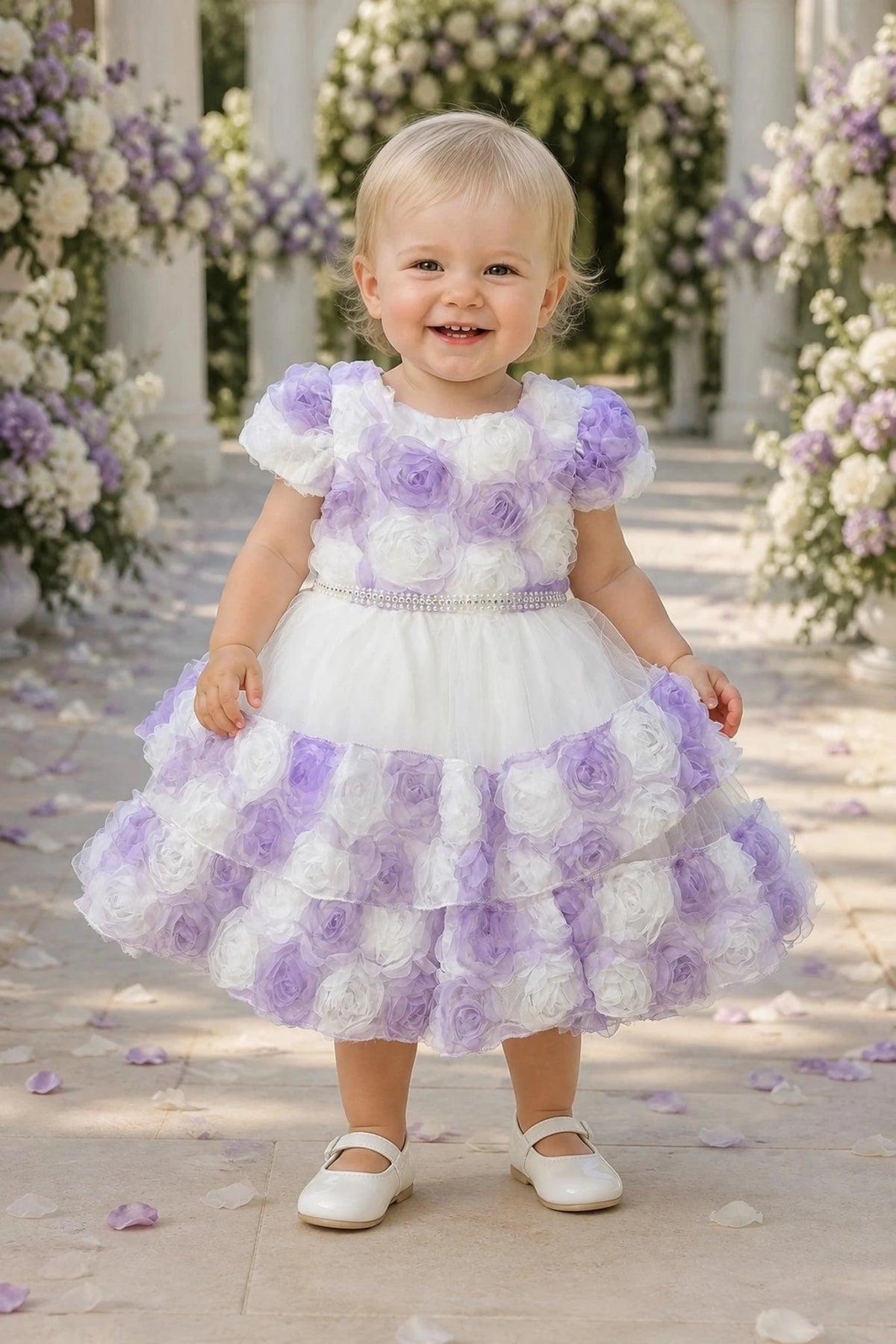 Showcasing rosette flowers across the skirt tiers, this Lilac kids dress has a full skirt.