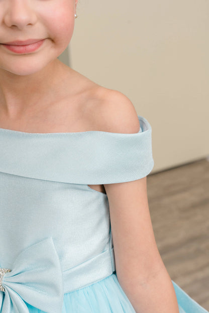 Details of the Blue flower girl dress include off-shoulder satin band framing the neckline.