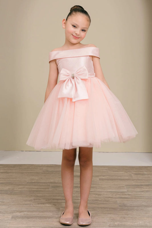 Blush flower girl dress features large front bow and layered tulle hem.