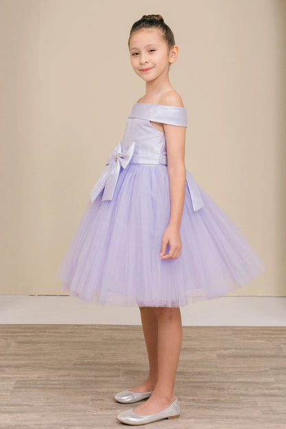 Featuring large front bow beside a flared tulle skirt on the Lilac flower girl dress.