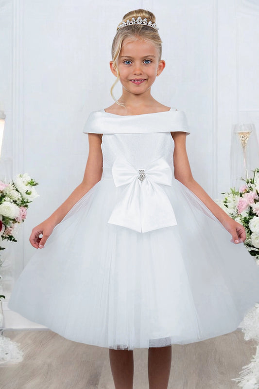 White flower girl dress features front jeweled bow above the layered skirt.