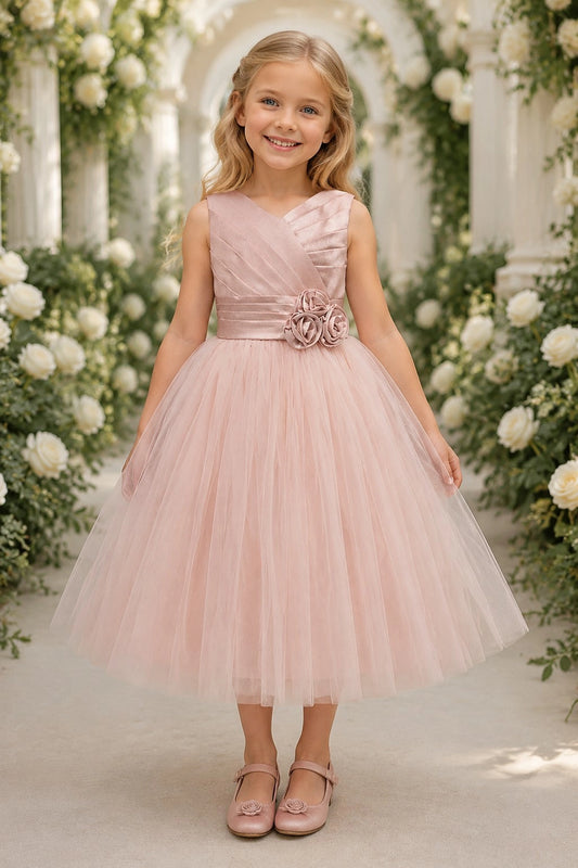 Showcasing rosette flowers at the waist, this Blush kids dress has a full skirt.