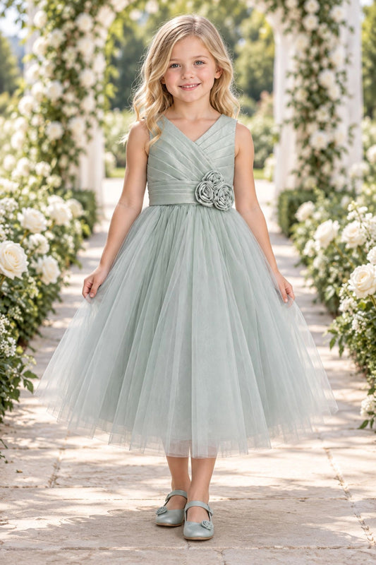 Showcasing rosette flowers at the waist, this Sage kids dress has a full skirt.