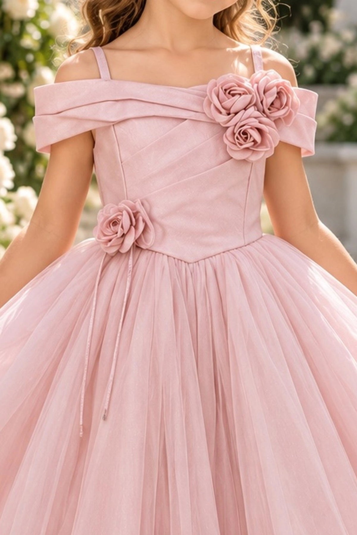 Detailed a folded off-shoulder neckline complements the Blush kids dress.