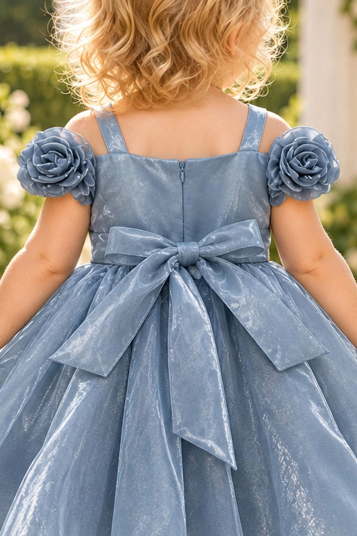 Detailed a sparkling narrow waistband complements the Dusty Blue kids dress.