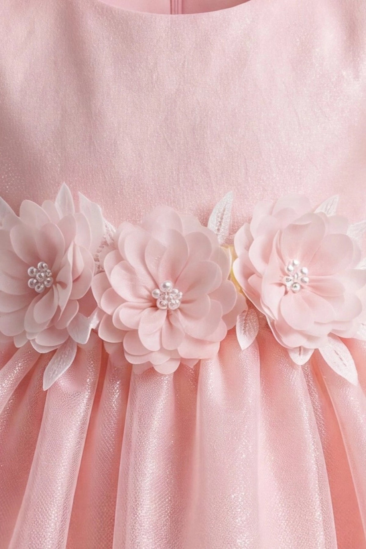 Detailed short puff sleeves complements the Blush kids dress.