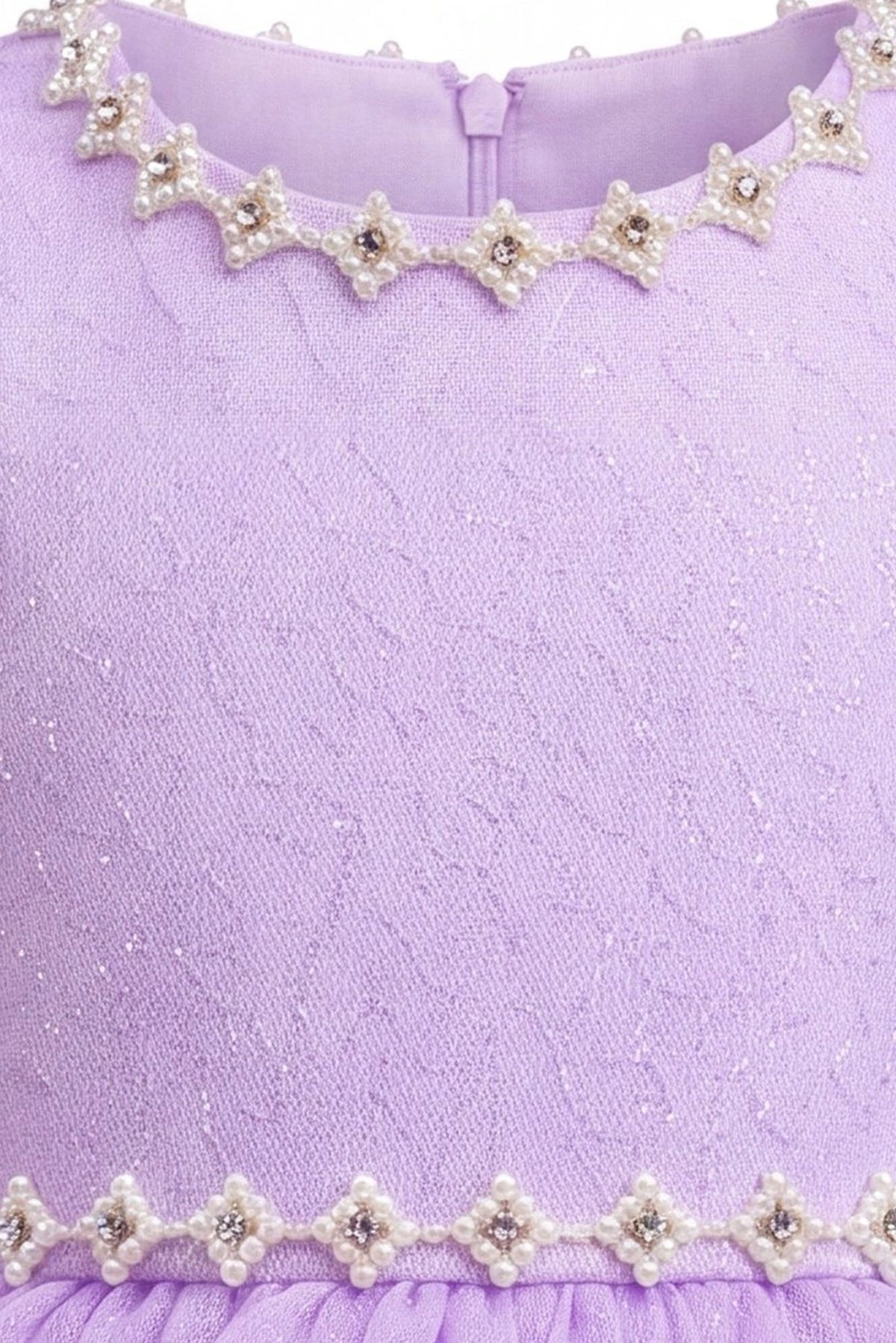 Detailed decorative trim at the neckline complements the Lilac kids dress.