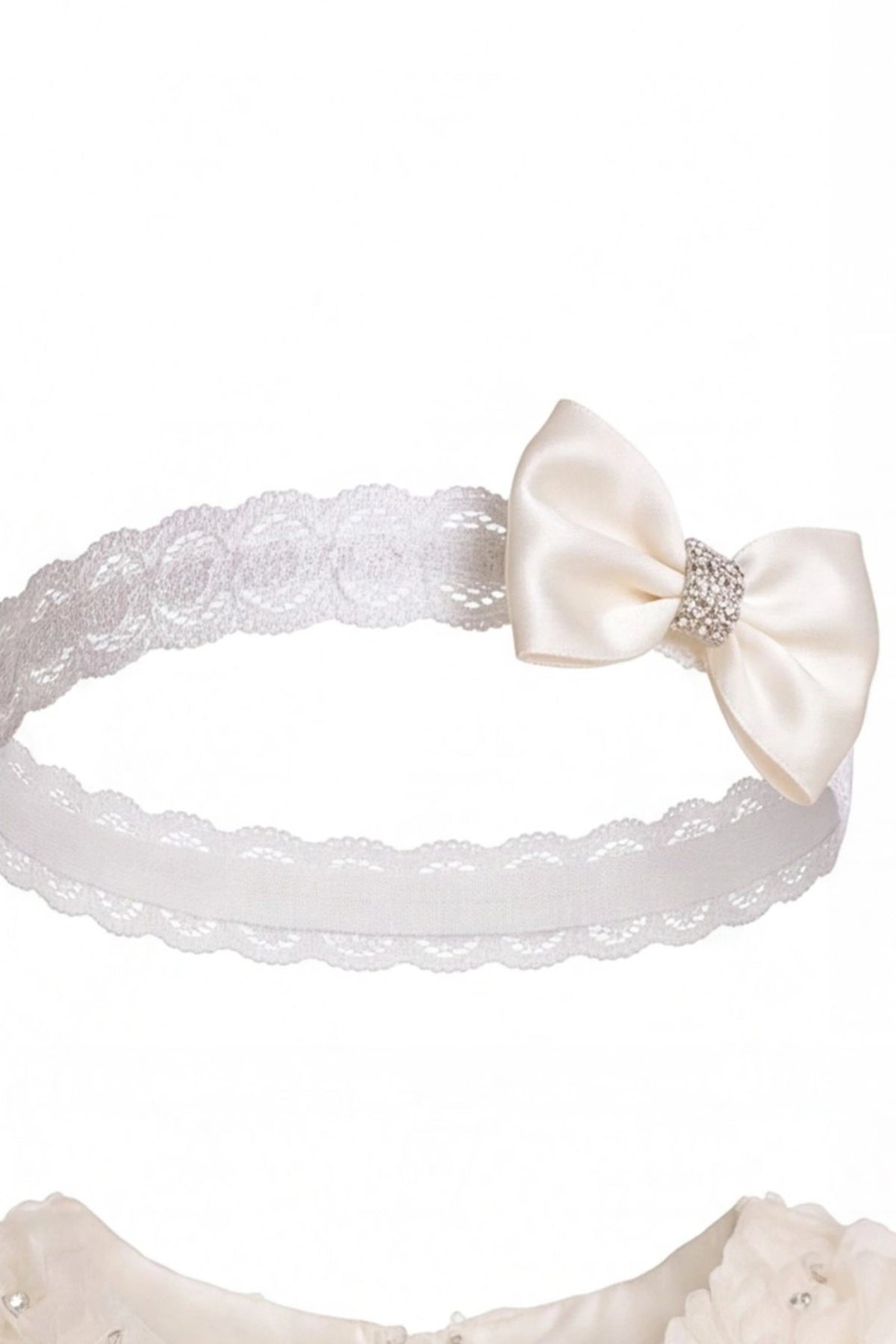 Matching bow headband accompanies the Champagne kids dress with rosette details across the bodice.