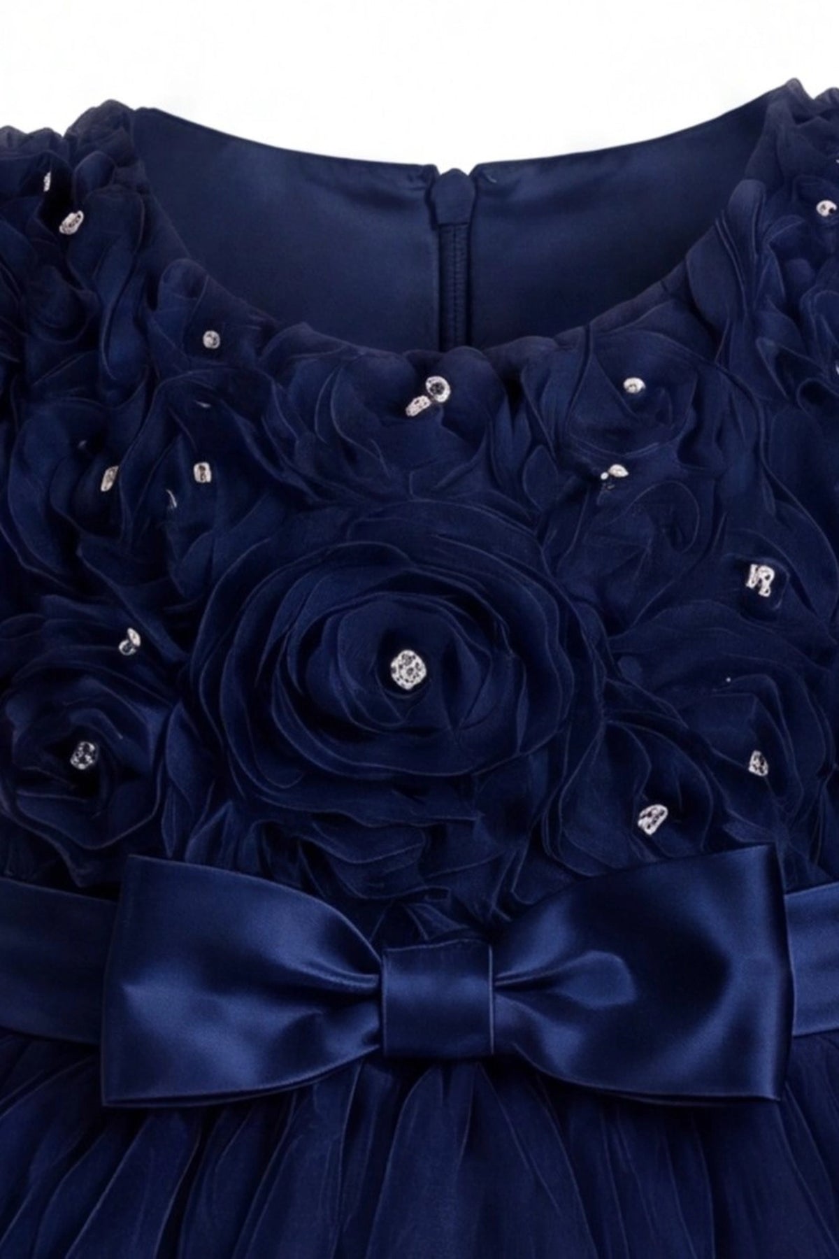 Detailed a ruffled tulle hem complements the Navy kids dress.