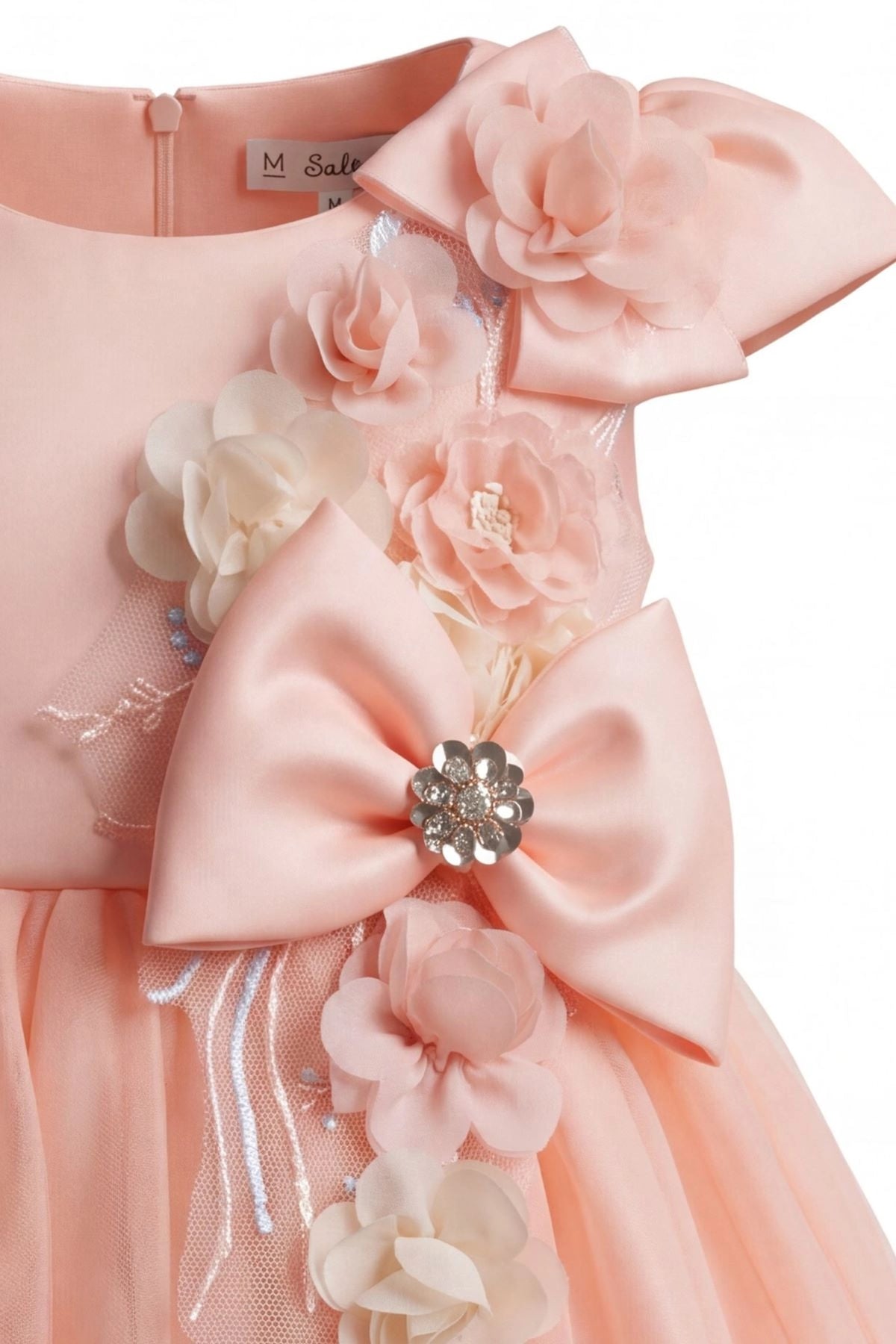 Detailed a jeweled bow at the waist complements the Blush kids dress.