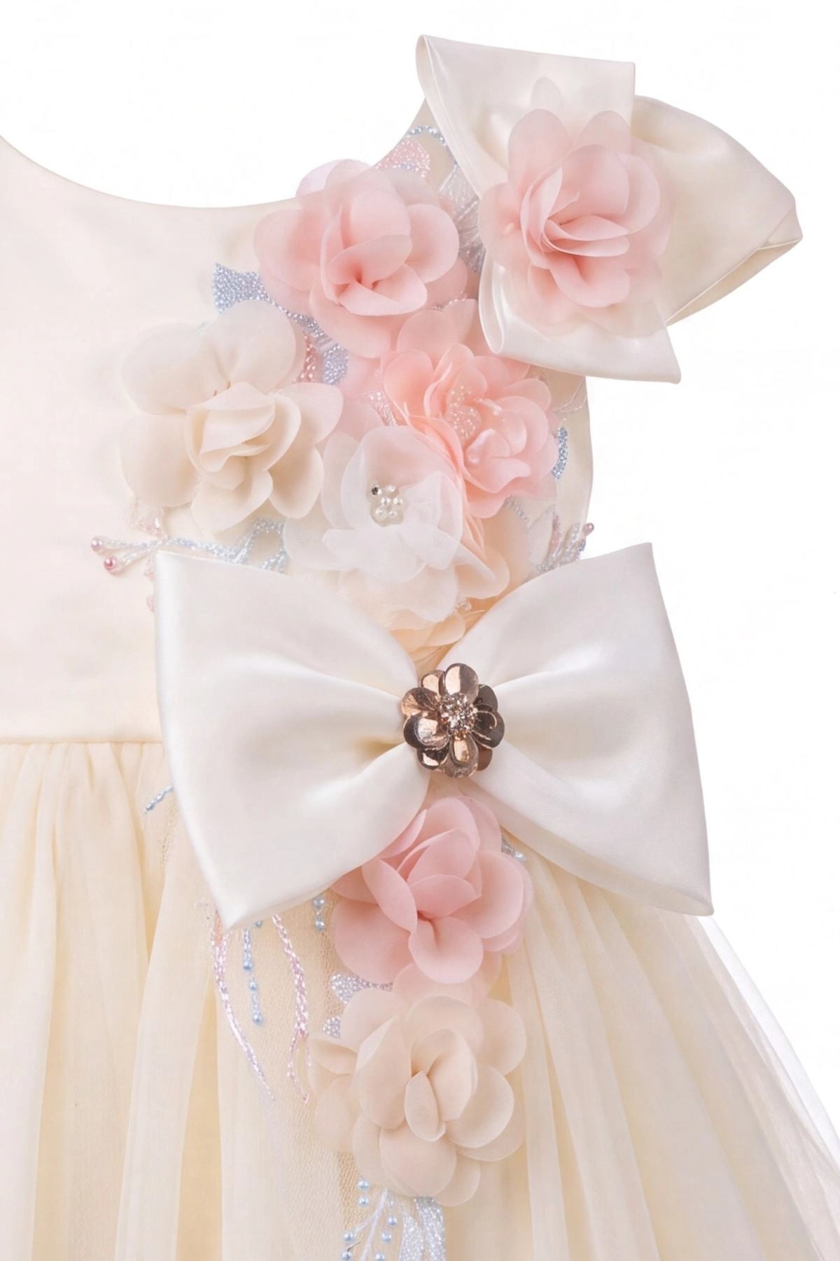 Detailed a jeweled bow at the waist complements the Champagne kids dress.