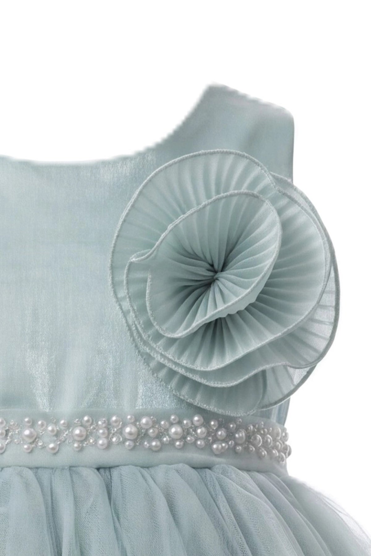 Detailed a pleated rosette at the waist complements the Sage kids dress.