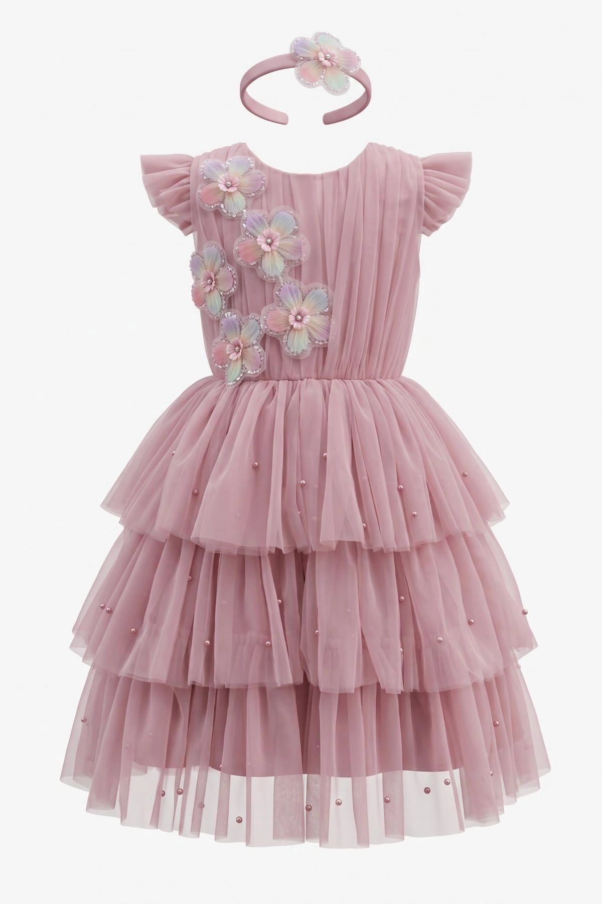 Layered shaping highlights three-dimensional flower appliques on the Rose kids dress.