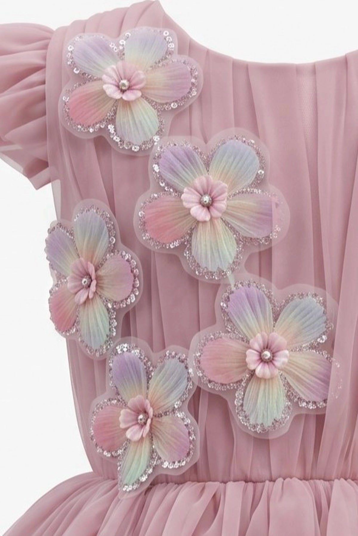 Detailed a tiered pearl-dotted skirt complements the Rose kids dress.