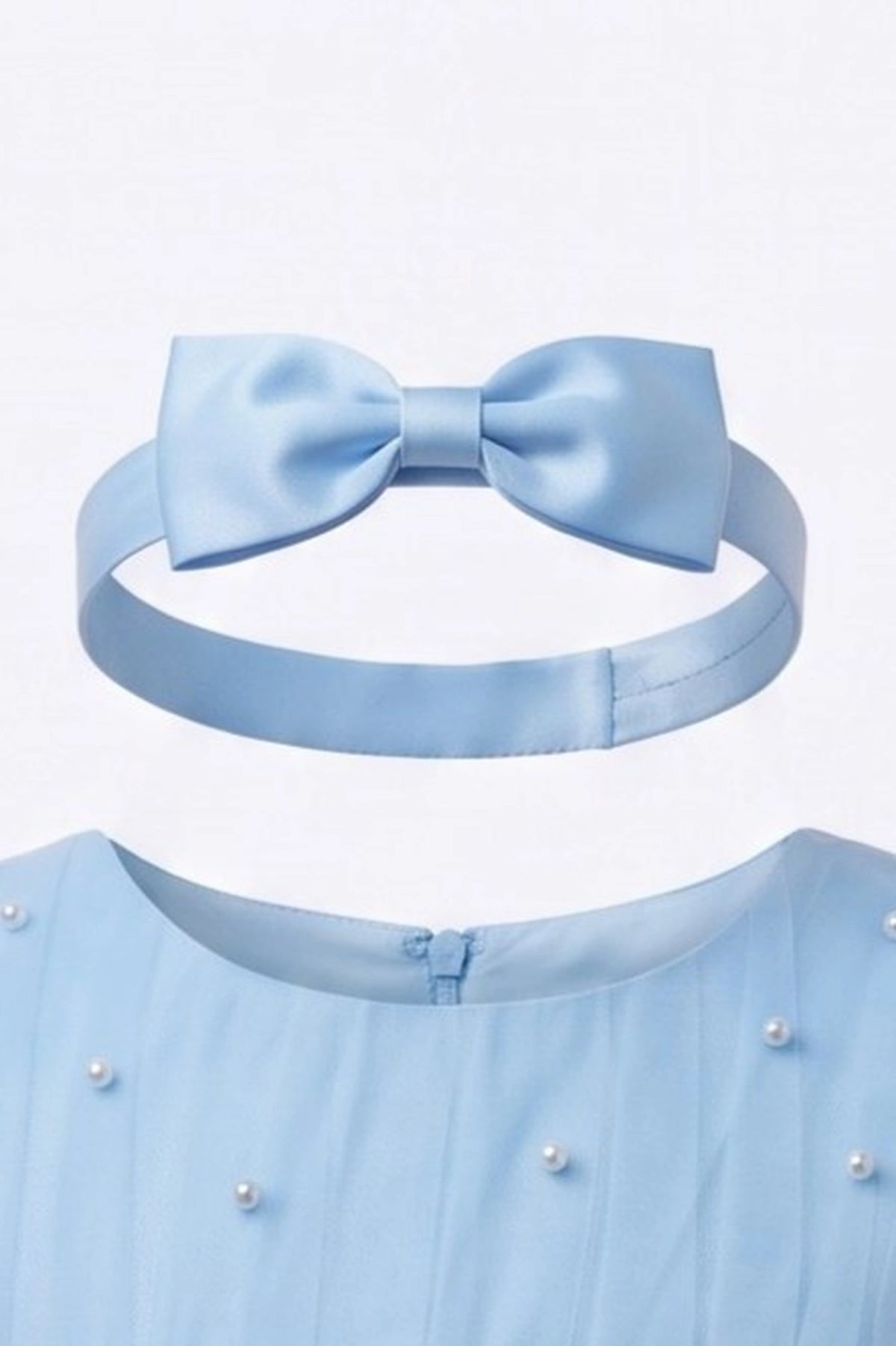 Matching bow headband accompanies the Blue kids dress with pearl accents across the bodice.