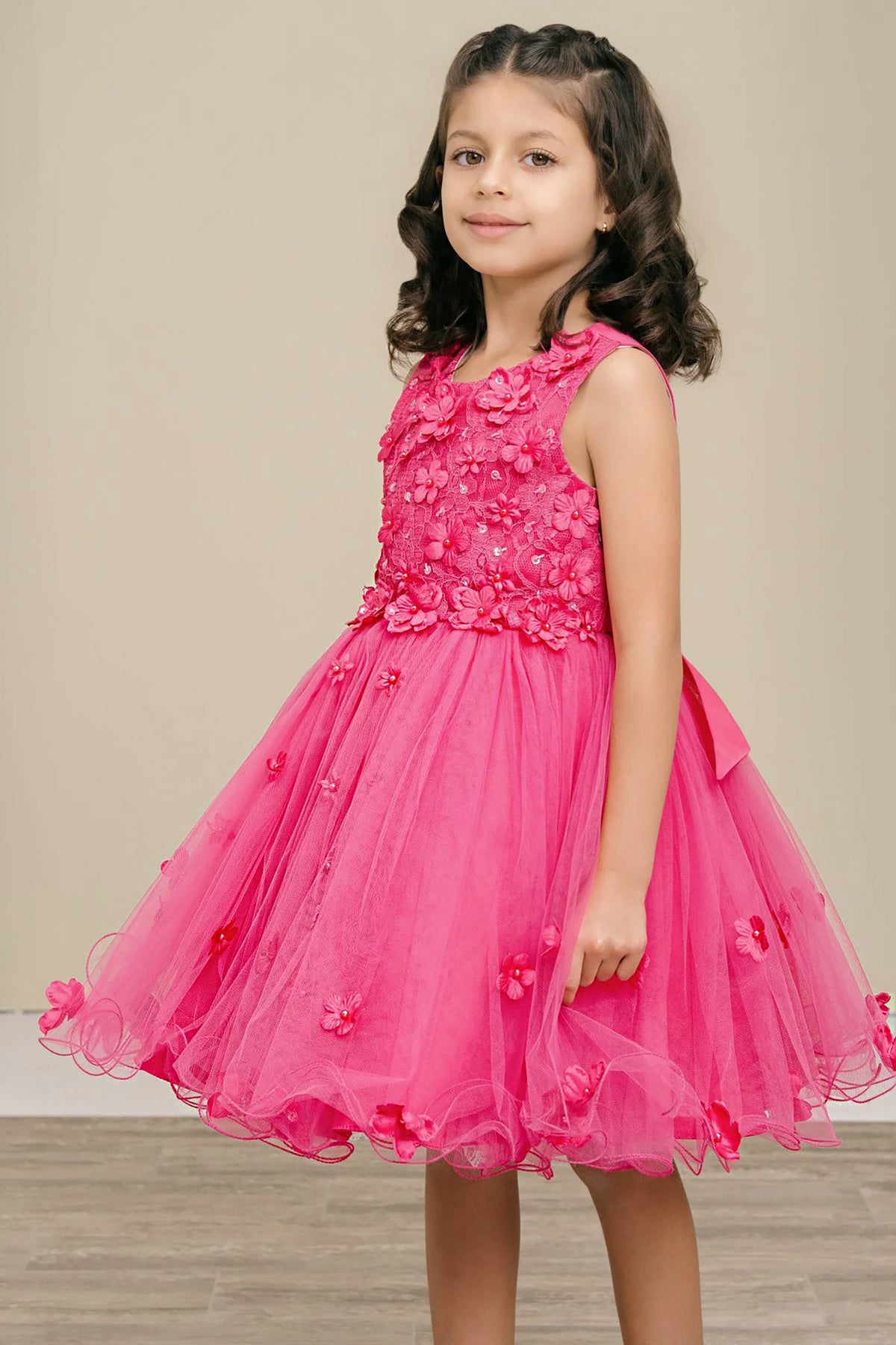 A fuchsia floral flower girl dress.