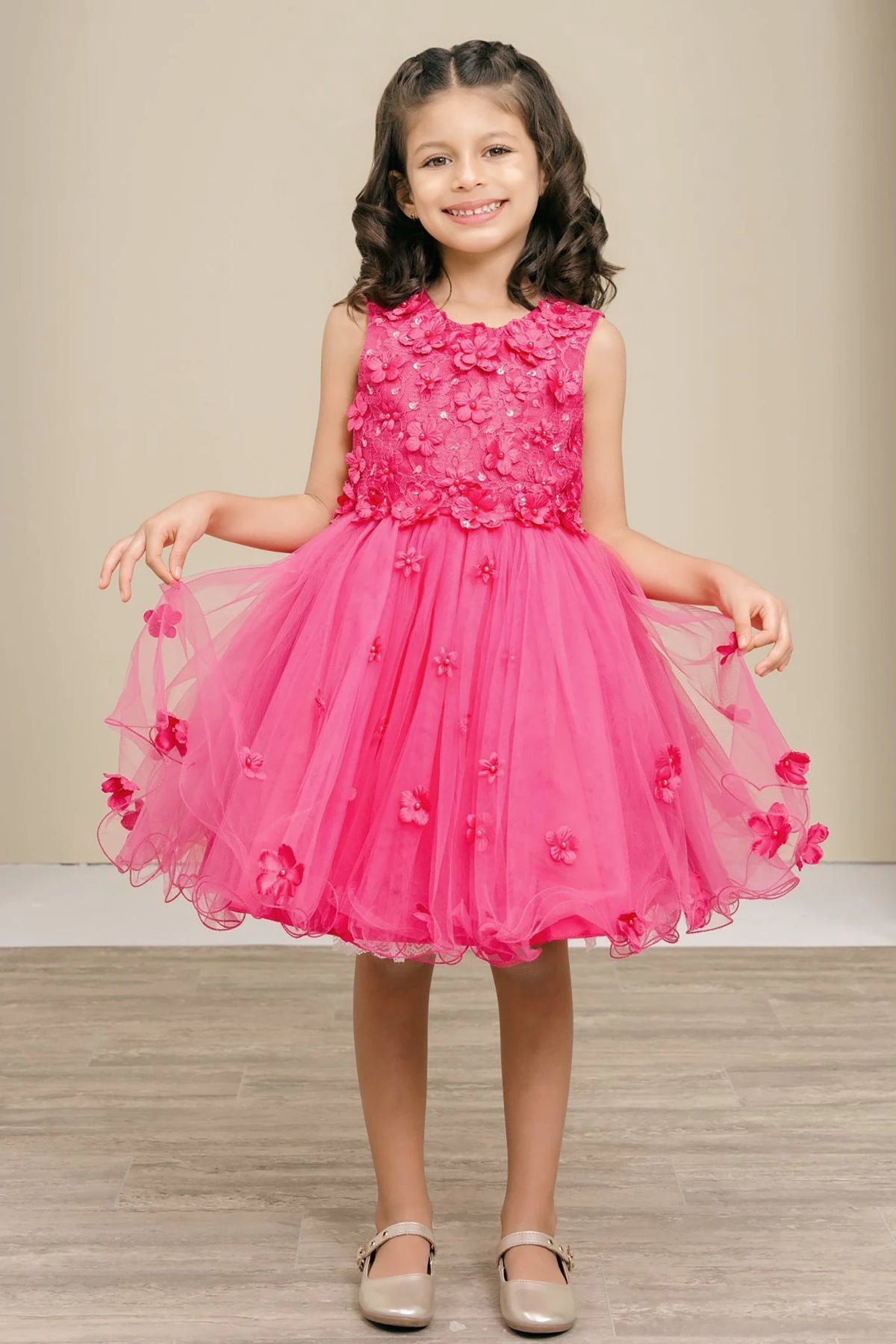 A fuchsia floral flower girl dress.