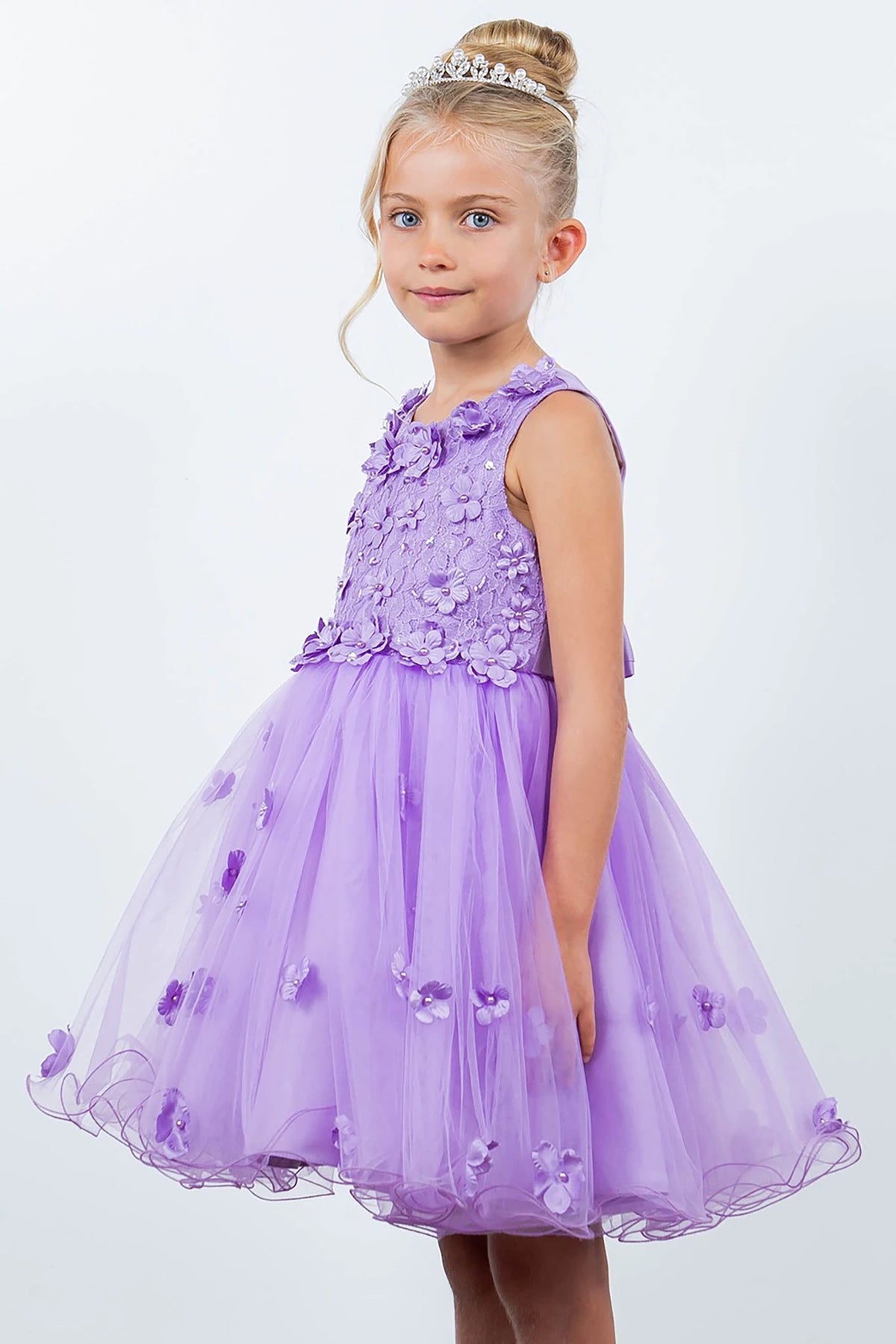 A lilac flower girl dress with floral details.