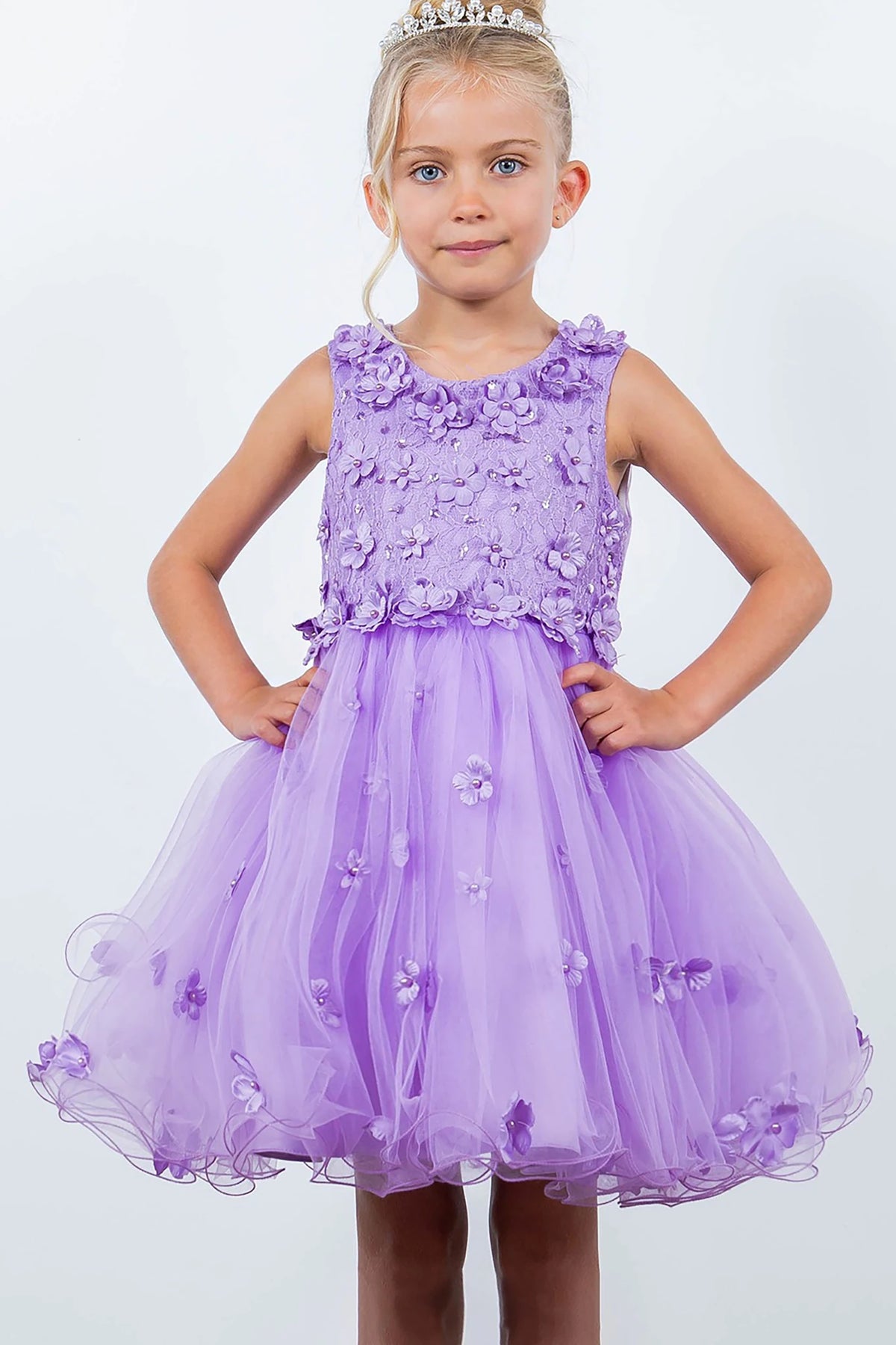 A lilac flower girl dress with floral embellishments.