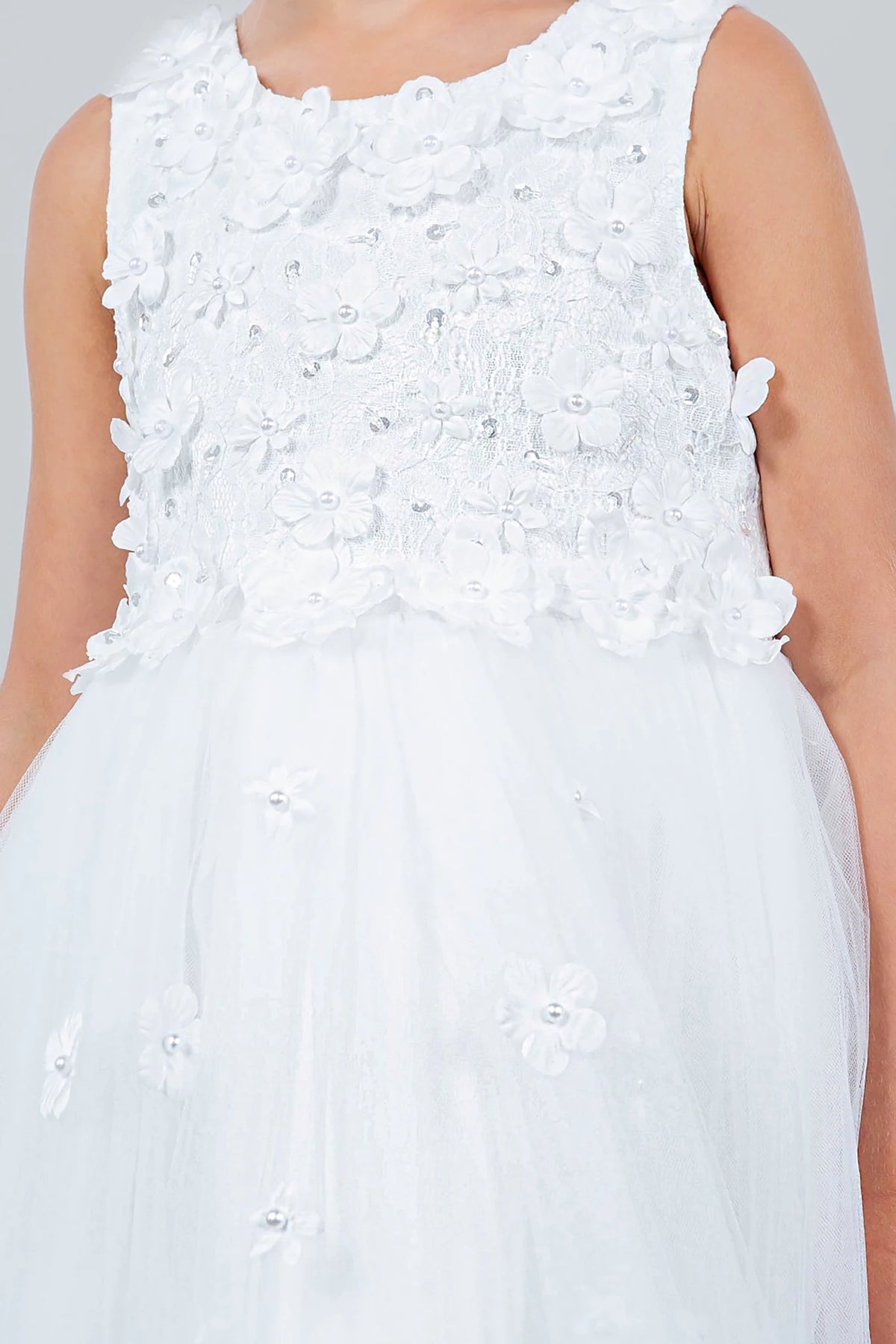 White flower girl dress with floral embellishments.