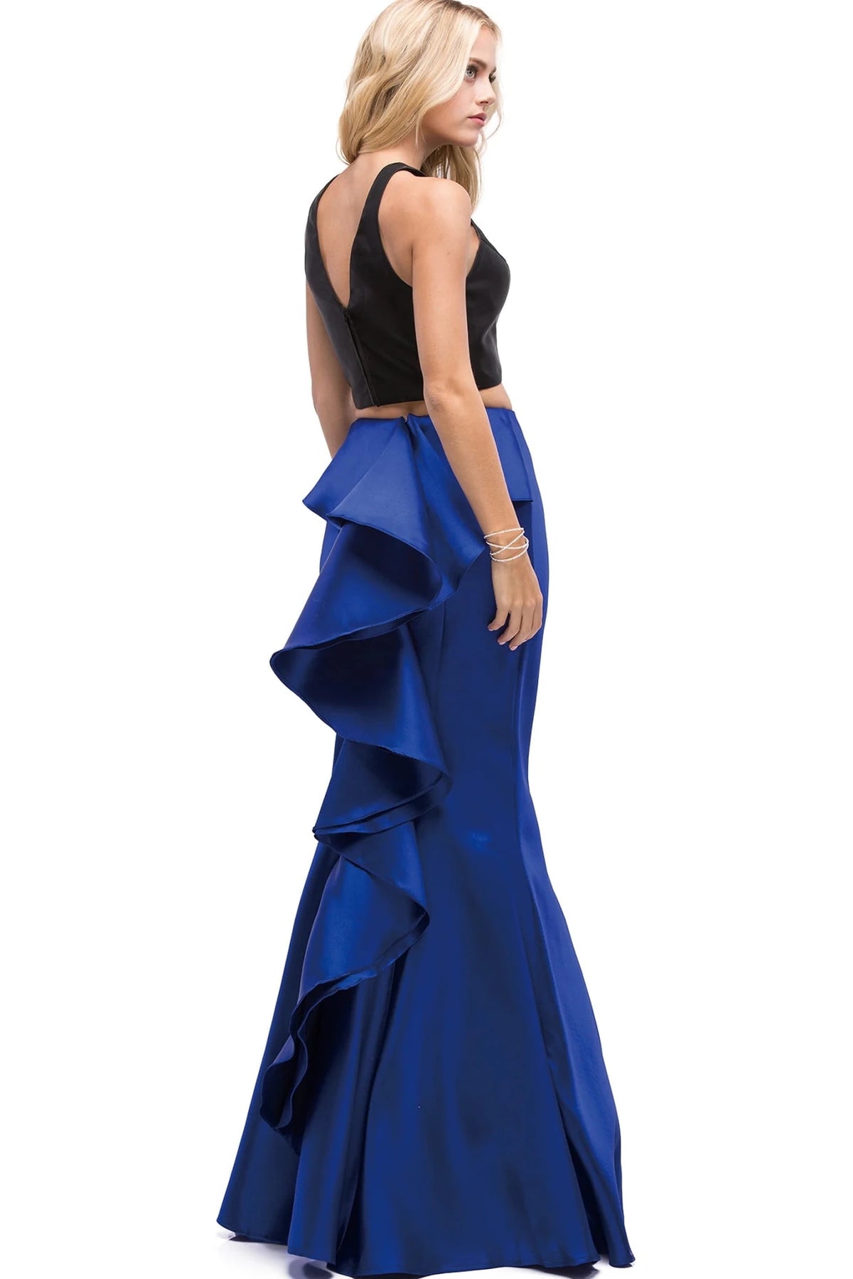 From the back, the Black/Royal Blue prom dress reveals its floor-length skirt.
