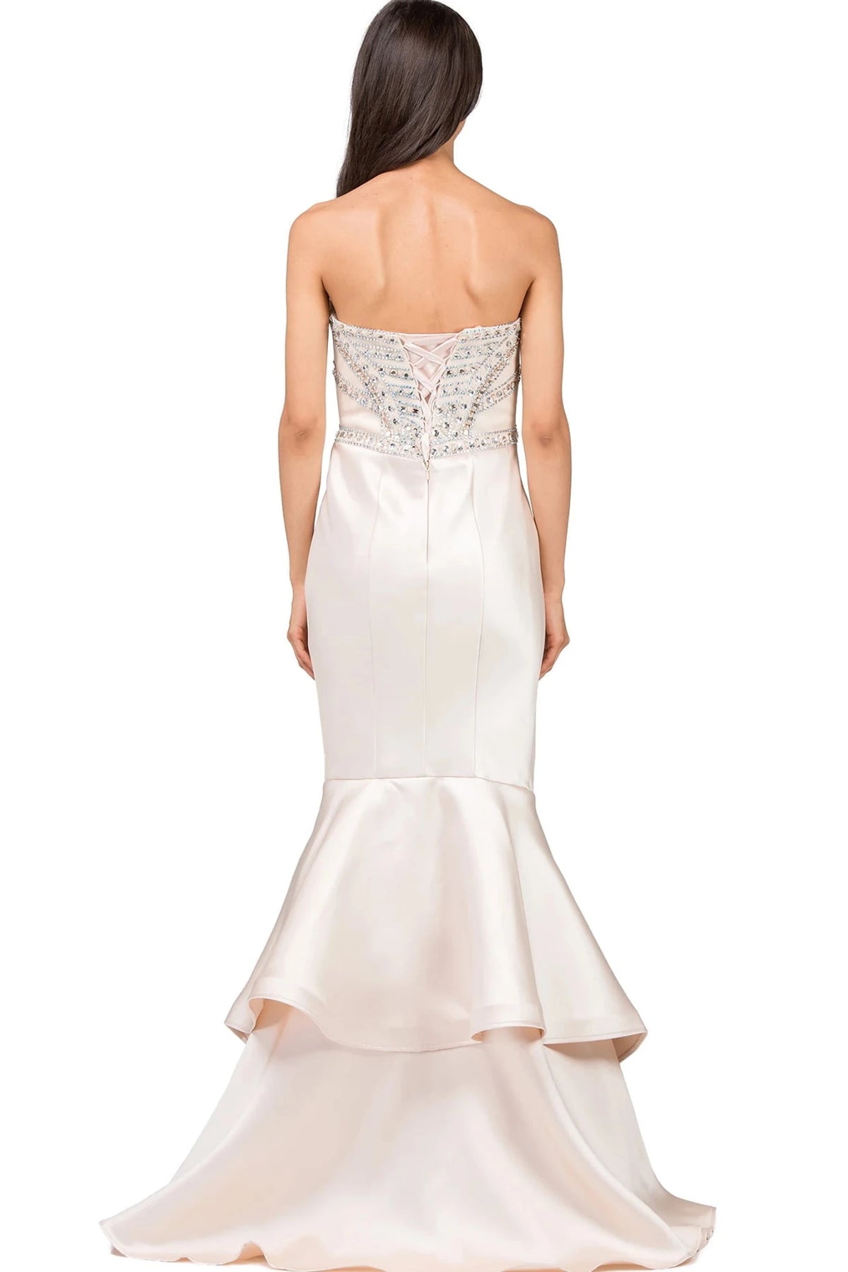 From the back, the Champagne prom dress reveals its floor-length skirt.
