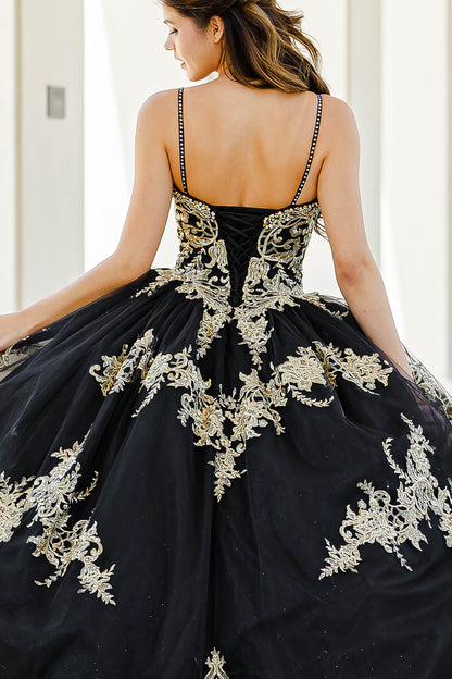 Quinceanera | Black with Gold Embroidered Lace with Stunning Cape Quince Ballgown dress - zoomed in back view of woman wearing dress